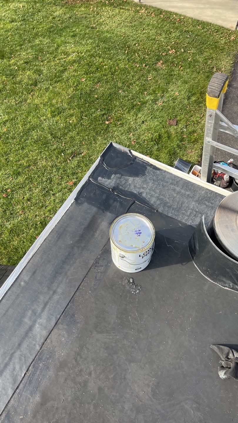 Flat EPDM roof on Furnace Road in Quarryville, PA with repaired membrane seams and flashing around the roof edge during a commercial roof repair.