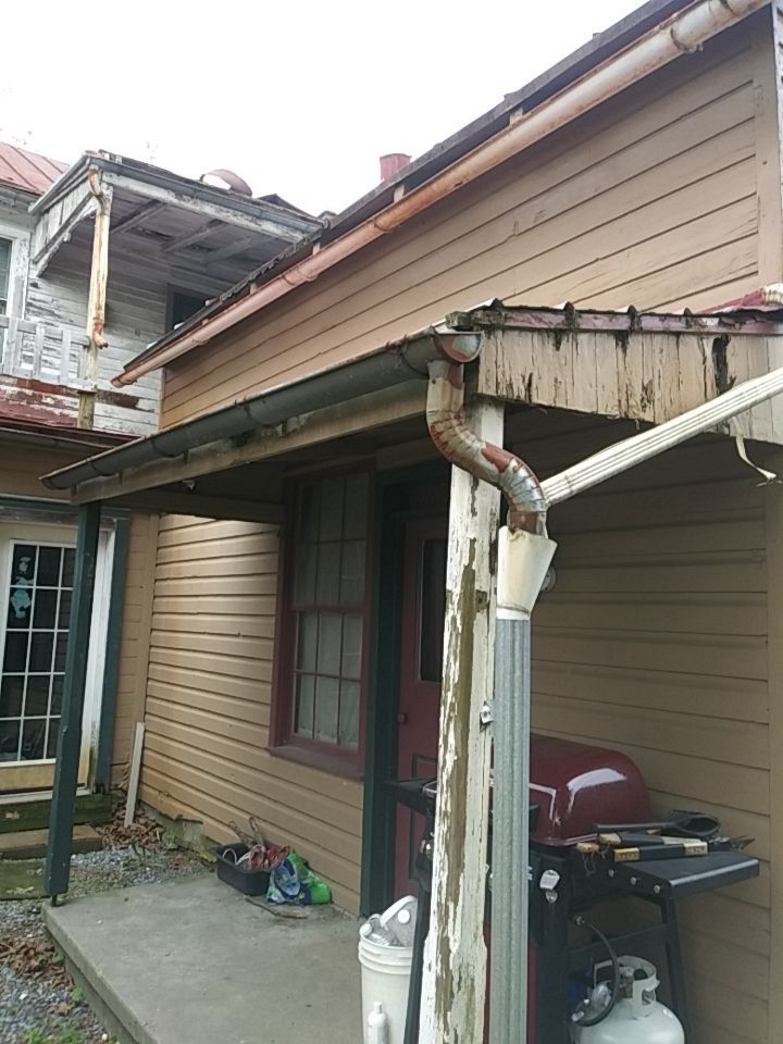 Deteriorated gutters, fascia boards, and porch roof on a home along Heidelberg Avenue in Schaefferstown, PA requiring professional roof and exterior restoration.