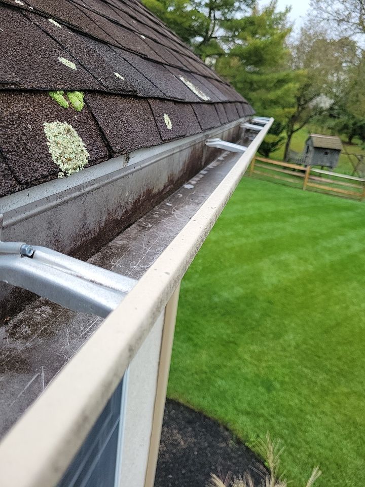 Weathered gutter system requiring repair by Joyland Roofing on Tanglewood Drive in North Wales, PA