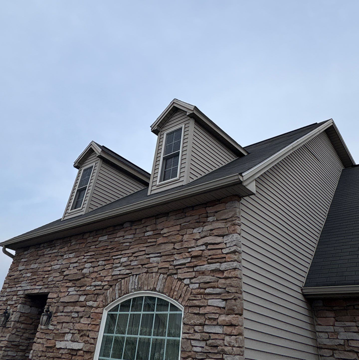 Asphalt shingle roof replacement completed on a home along Harwich Court in New Cumberland, PA by Joyland Roofing.