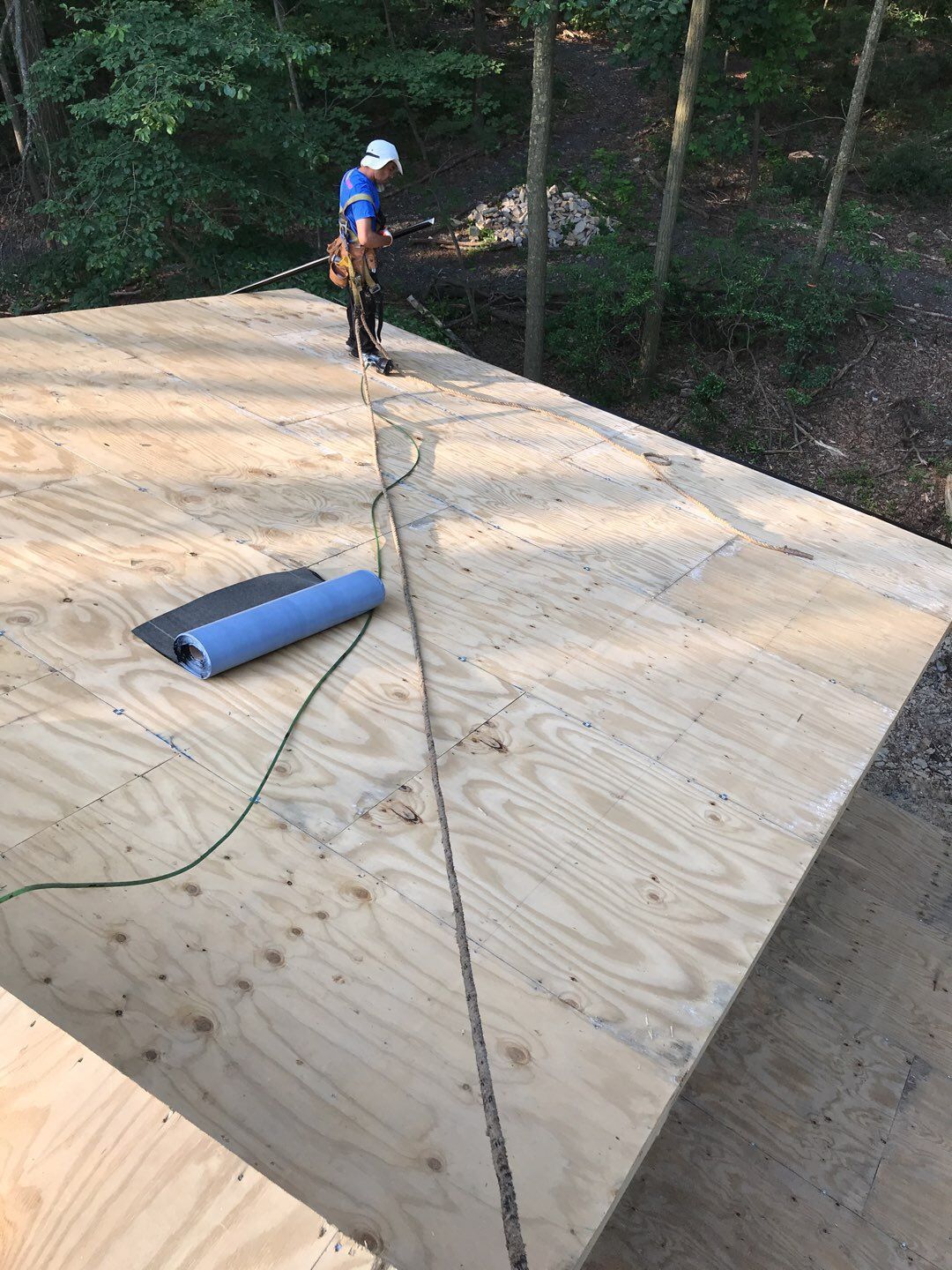 Roof deck replacement underway on Hawthorne Lane in Boyertown, PA, with new plywood sheathing installed.