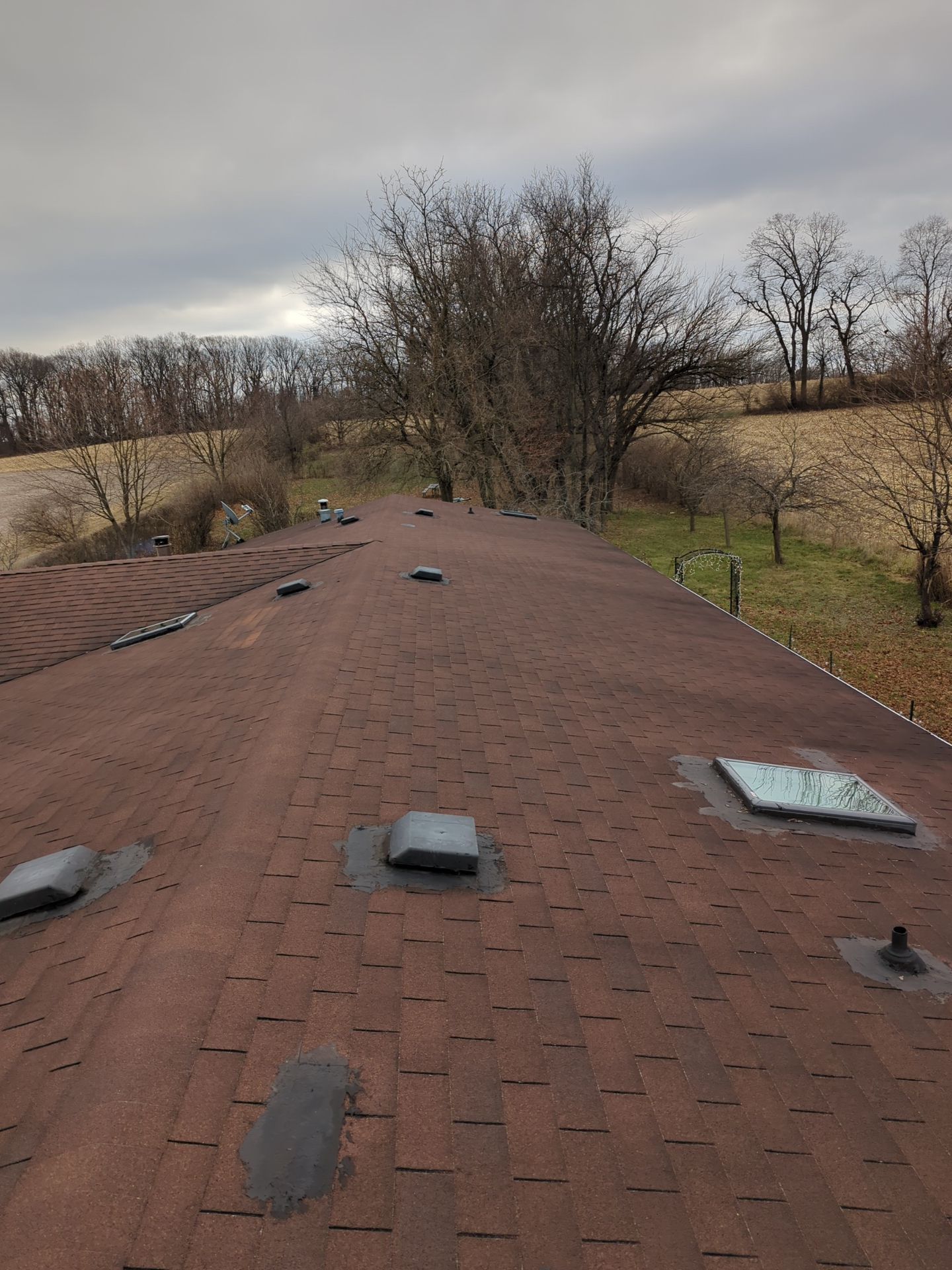 Asphalt shingle roof inspection on Hecktown Road in Shoemakersville, PA with skylights, roof vents, and ridge line visible.