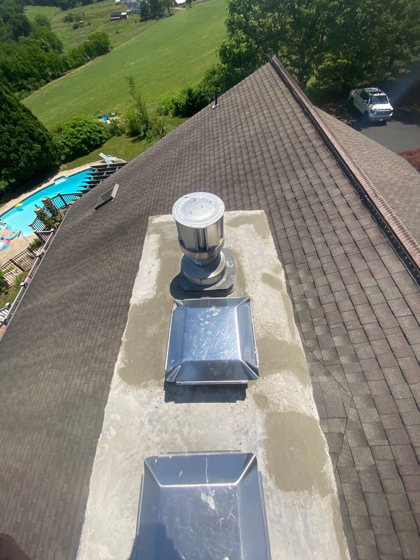 Professional chimney flashing restoration and asphalt shingle roof repair completed on Heffner Road by Joyland Roofing.