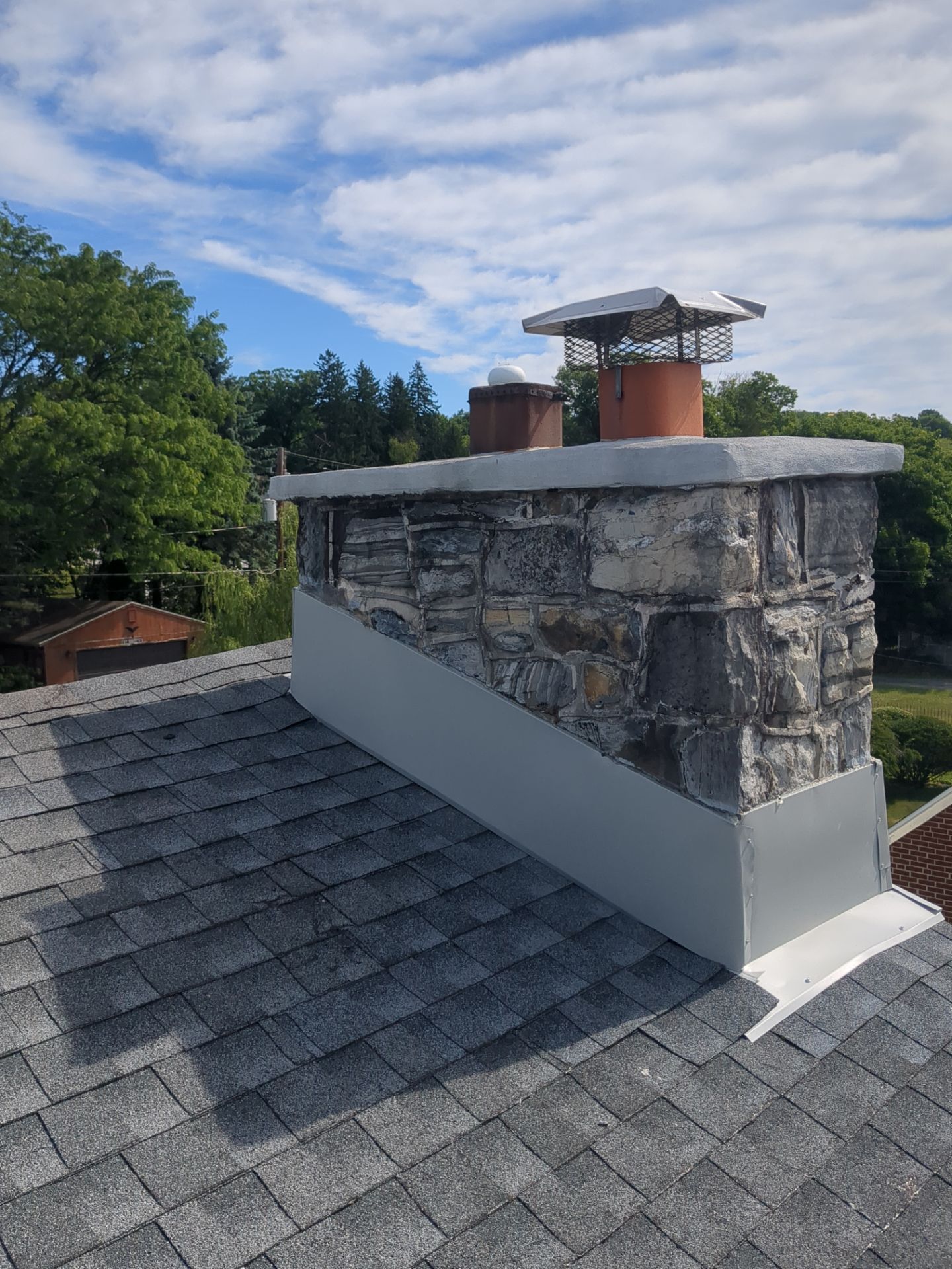 New chimney flashing installed during a roof repair project on Highland Street in Reading, PA.