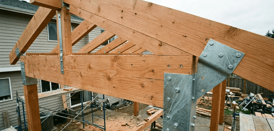 Reinforced patio roof framing with structural brackets for durable and climate-resilient extension patio roof ideas