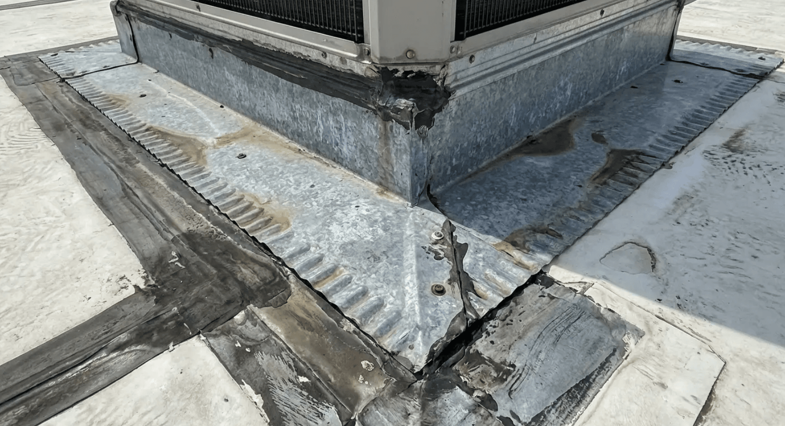 Failed flashing at HVAC penetration - a leading cause of short flat roof lifespan