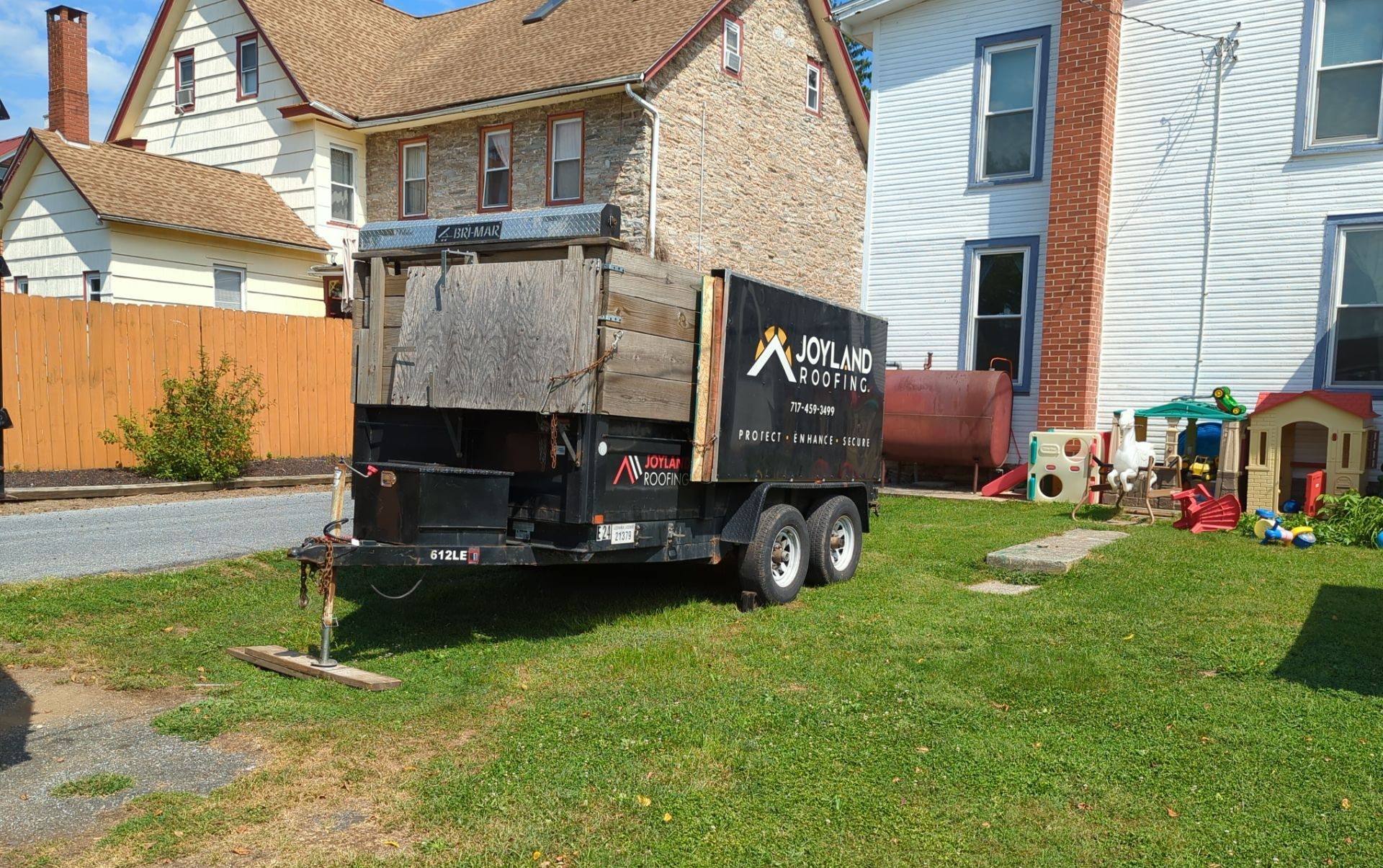Joyland Roofing equipment trailer positioned at a residential property on South Market Street in Schaefferstown, PA before a scheduled roof replacement project.