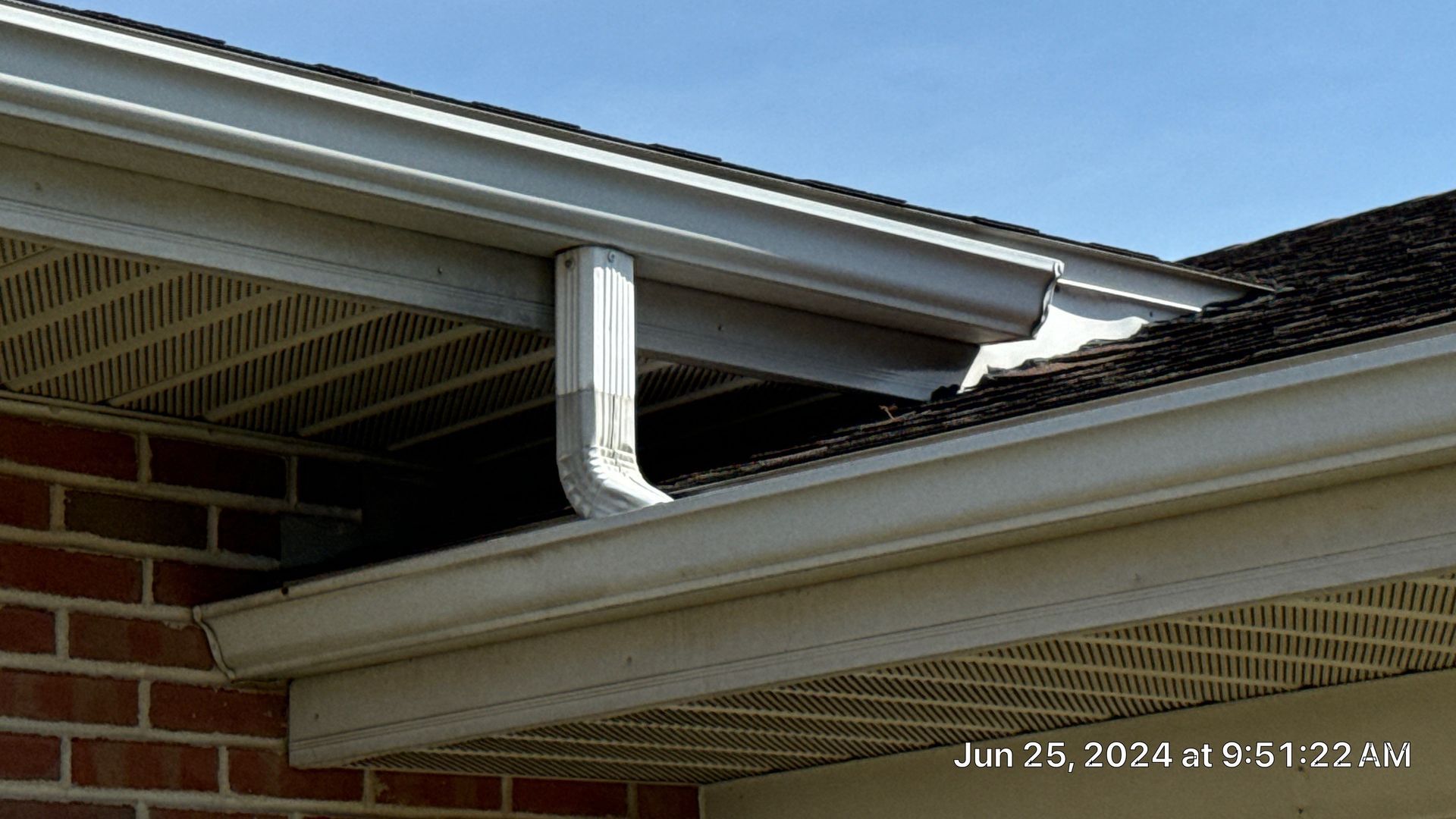 Commercial gutter and downspout connection inspected during roof maintenance at K Building in Kutztown, PA.