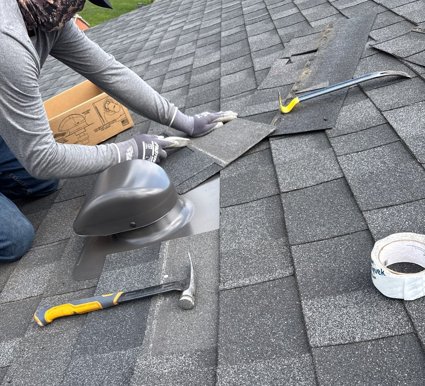 Joyland Roofing technician installing a new roof vent on an asphalt shingle roof in Lancaster, PA.