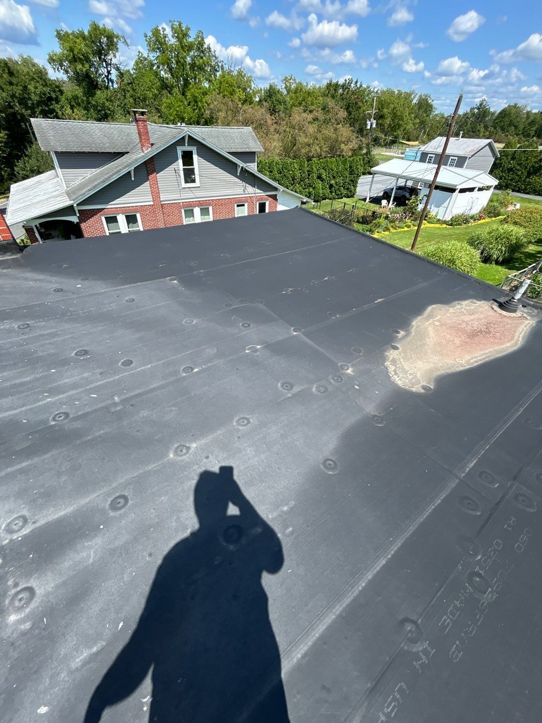 Completed EPDM flat roof replacement on a residential property on Main Street in Shoemakersville, PA.