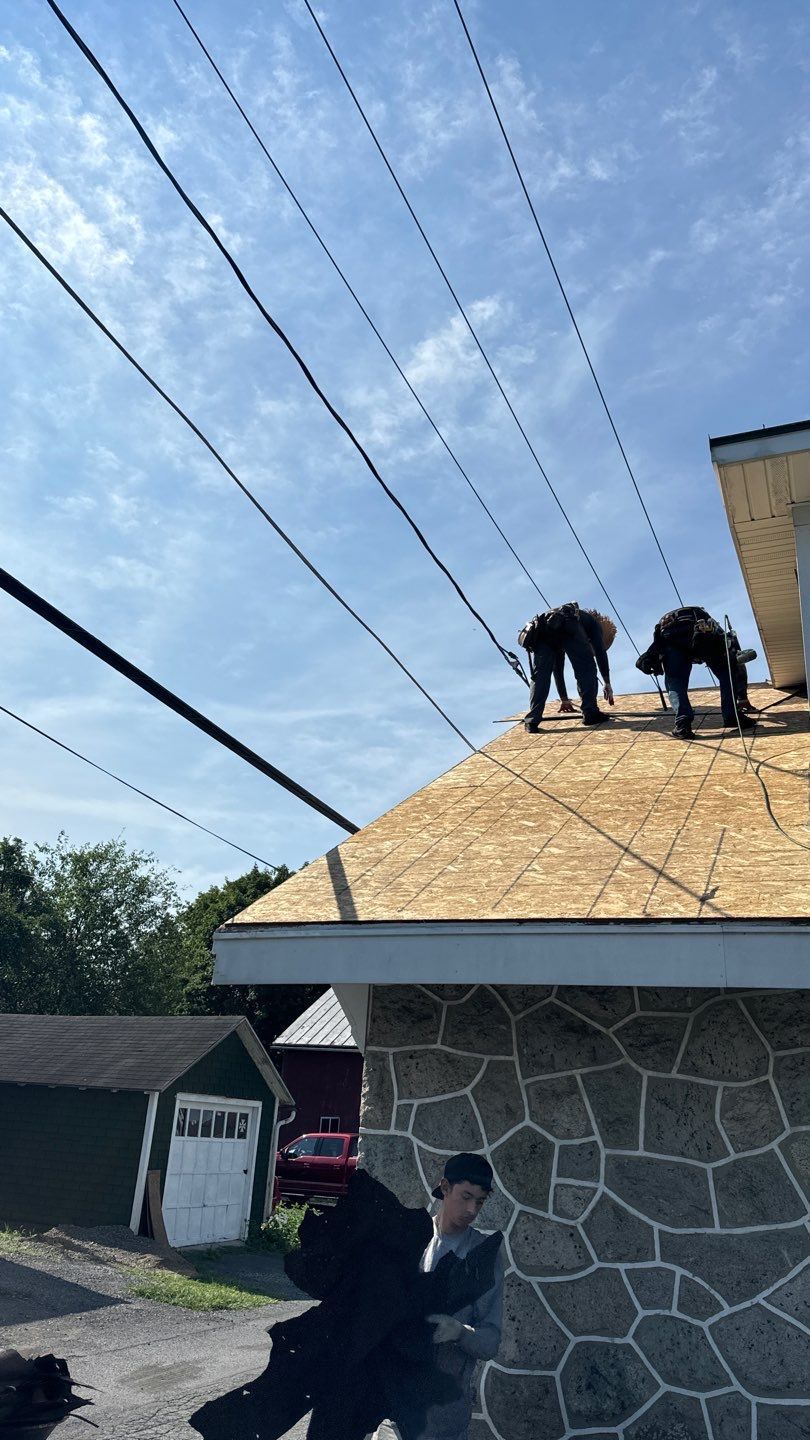 Roof replacement in progress with new roof decking being installed on a home on Main Street in Shoemakersville, PA.