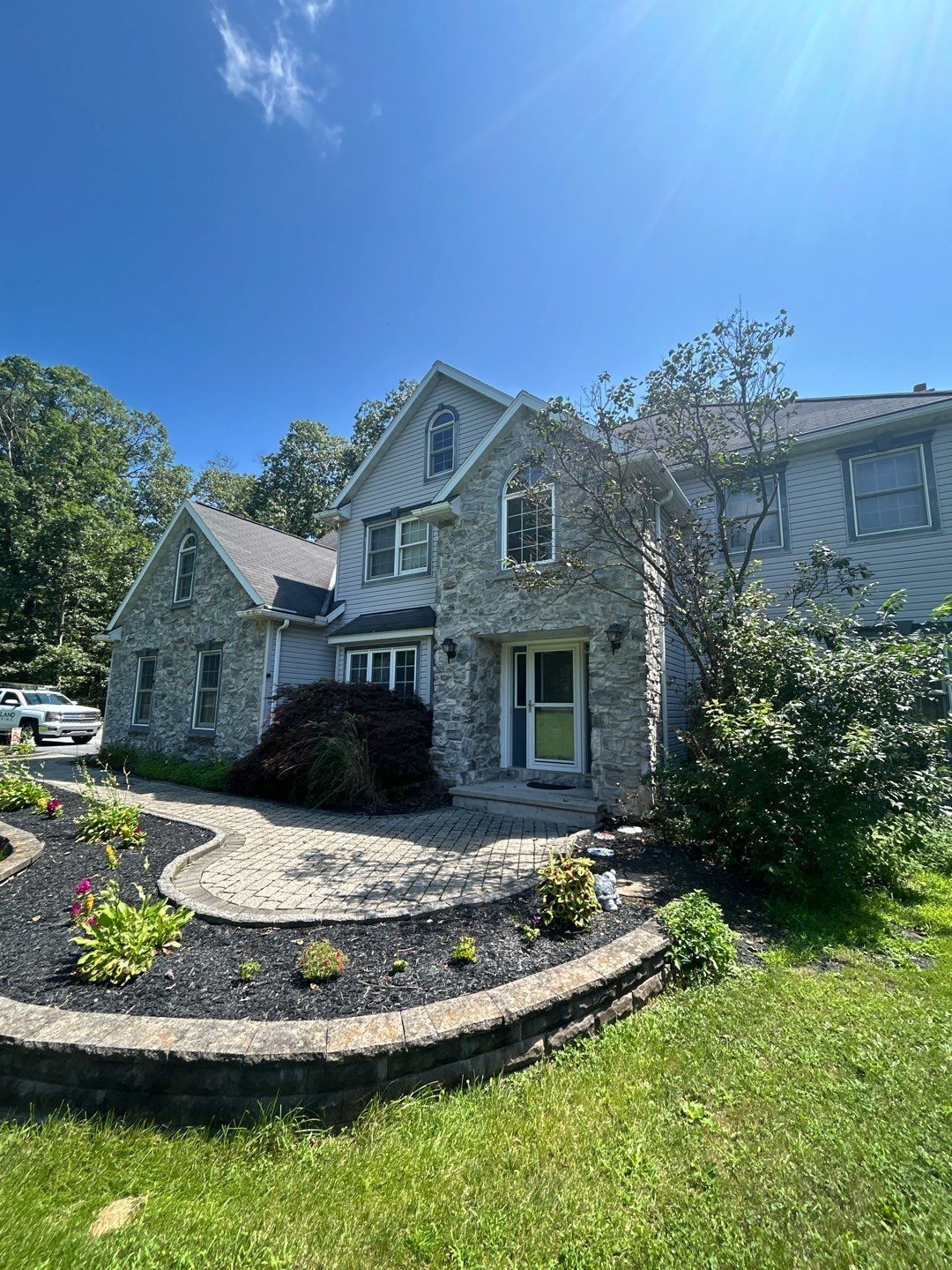 Residential home with asphalt shingle roofing on Mountain Road in Hamburg, PA.
