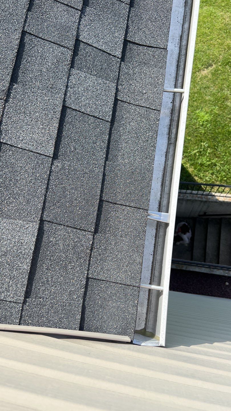 Close-up of a newly installed asphalt shingle roof and gutter system completed by Joyland Roofing in York, PA.