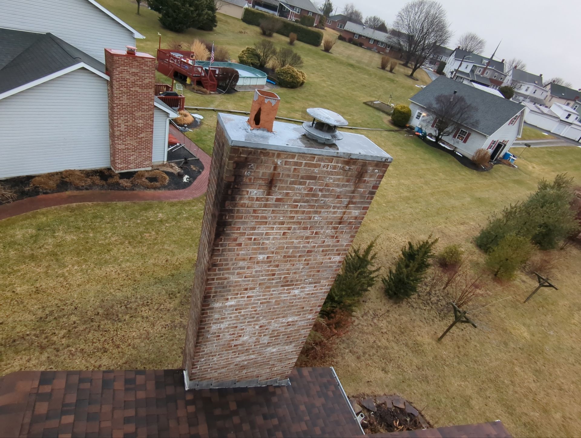 Brick chimney inspected during an asphalt shingle roof replacement project on North Kemp Street in Kutztown, PA.