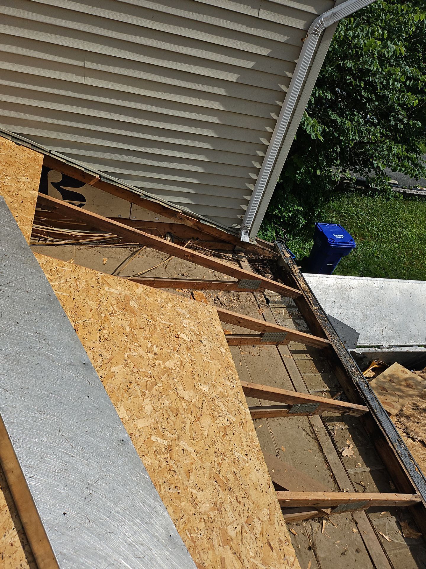 Roof replacement in progress on Old Blue Rock Road in Millersville, PA including roof deck replacement and structural repairs.