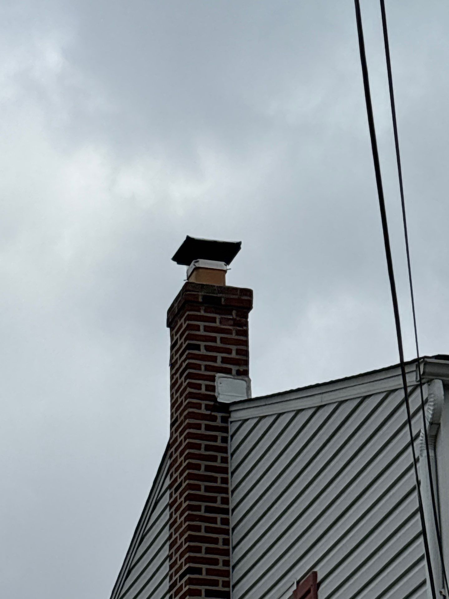 Brick chimney and standing seam metal roof on Michigan Avenue in Swarthmore PA