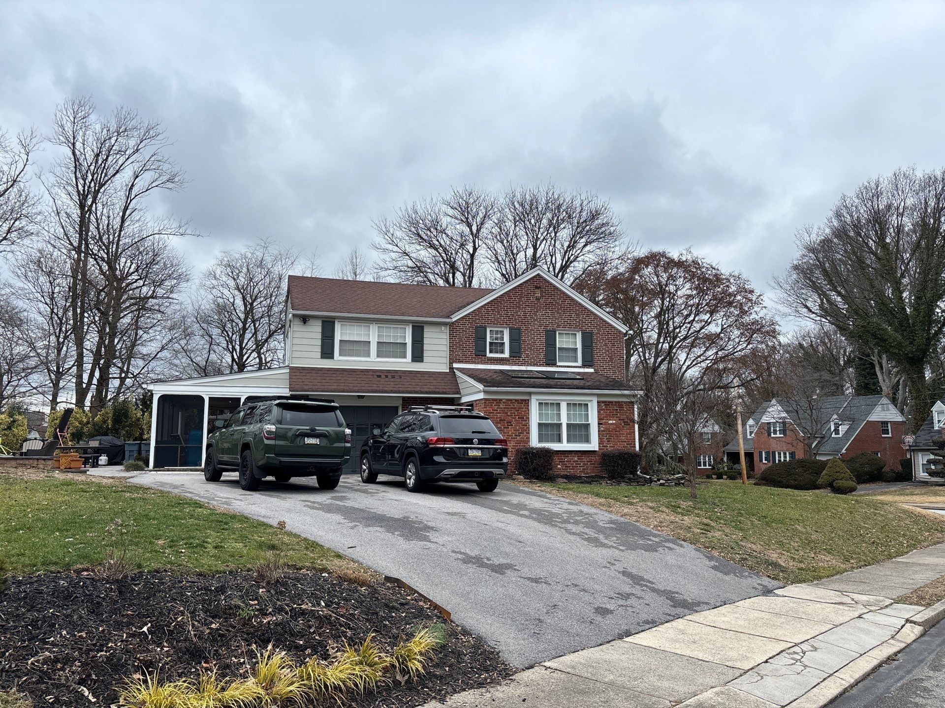 Residential asphalt shingle roof on a brick and siding home on School Lane in Springfield PA