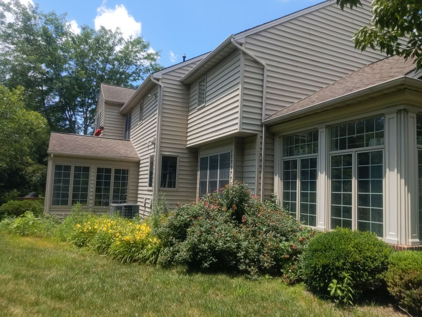 Completed residential asphalt shingle roof on a two-story home in Fort Washington, PA