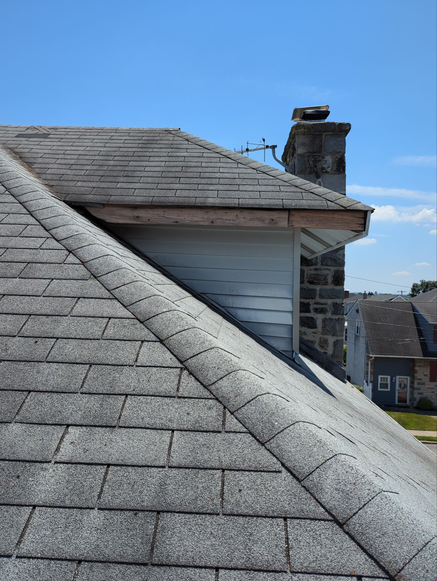 Asphalt shingle roof replacement with chimney and ridge detail on Johnson Avenue in Ridley Park PA