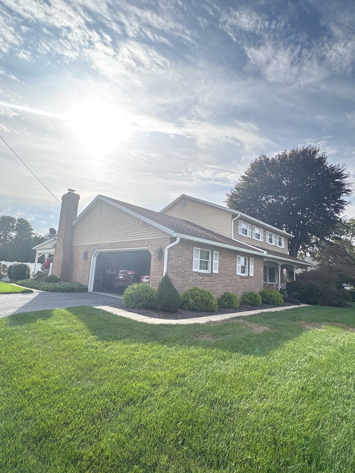 Completed residential roof replacement project on a brick home located on Lake Drive in East Petersburg, PA.