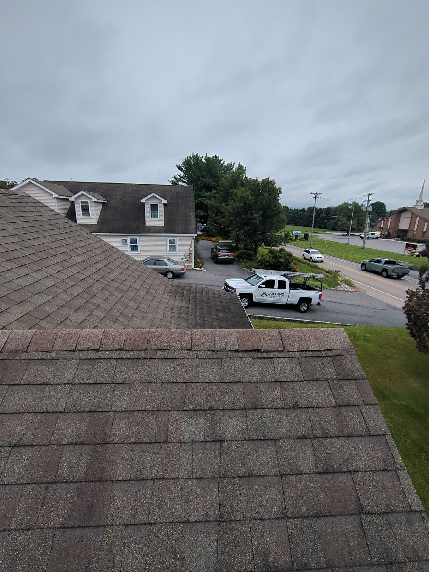 Roof inspection on a home along York Road in Carlisle, PA, before a residential roof replacement by Joyland Roofing.