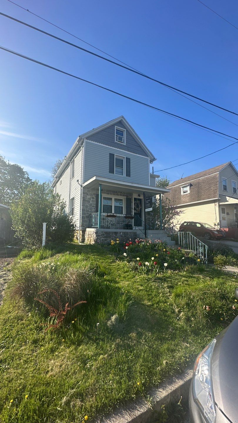 Residential roofing project on Fairview Avenue featuring a well-maintained sloped shingle roof and detailed exterior roofline