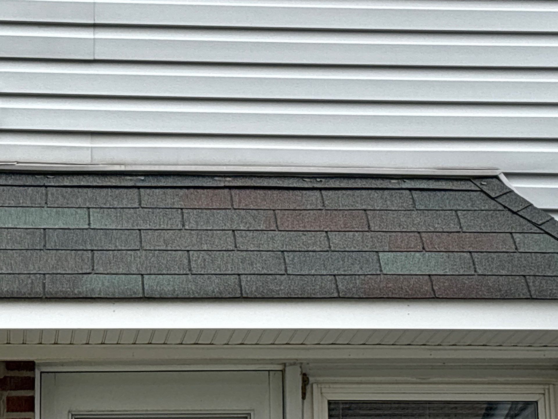 Asphalt shingle roof and siding detail on Michigan Avenue in Swarthmore PA