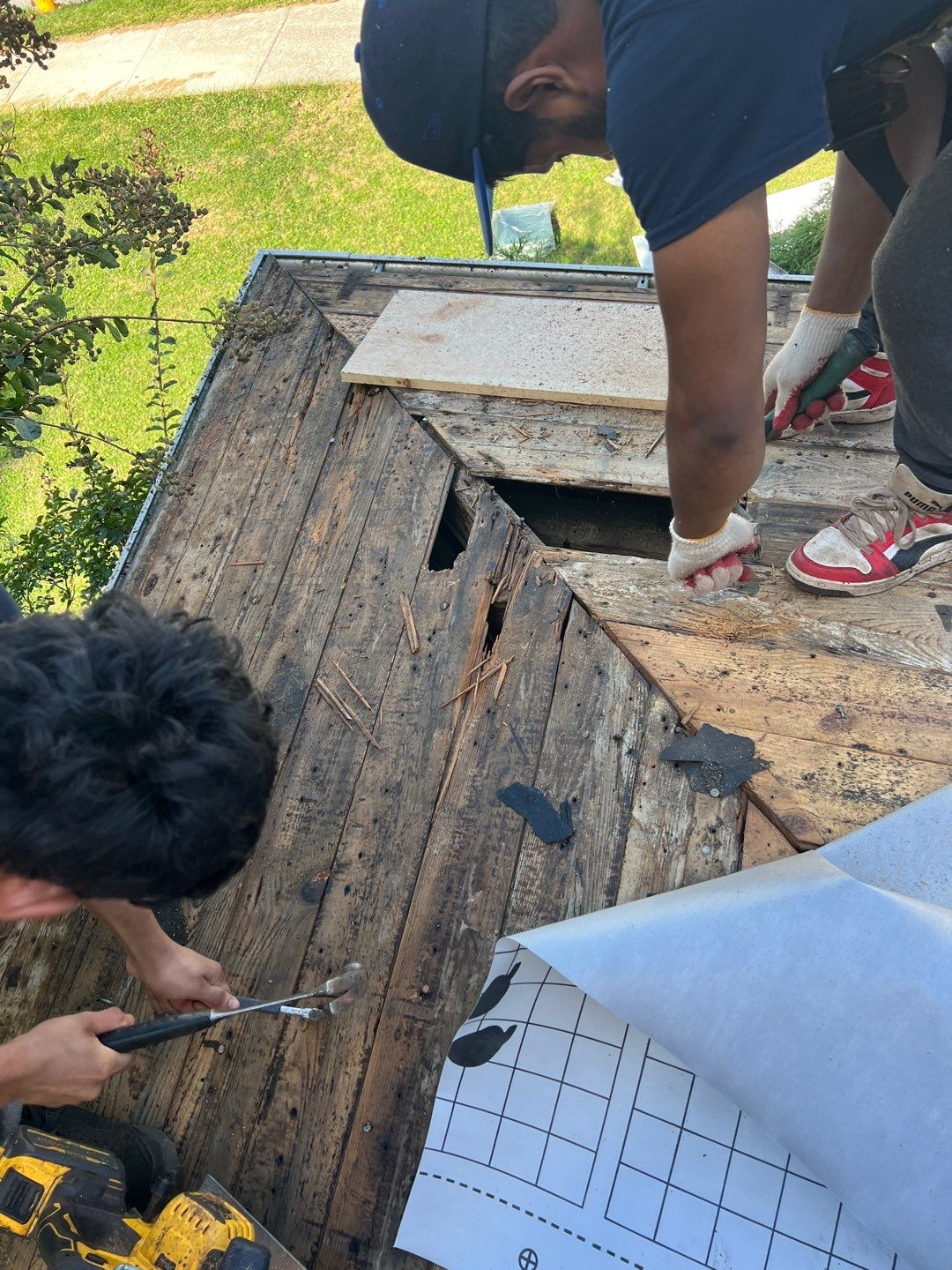 Joyland Roofing crew replacing damaged roof decking during a residential roof repair project on Broadway in Stewartstown, PA.