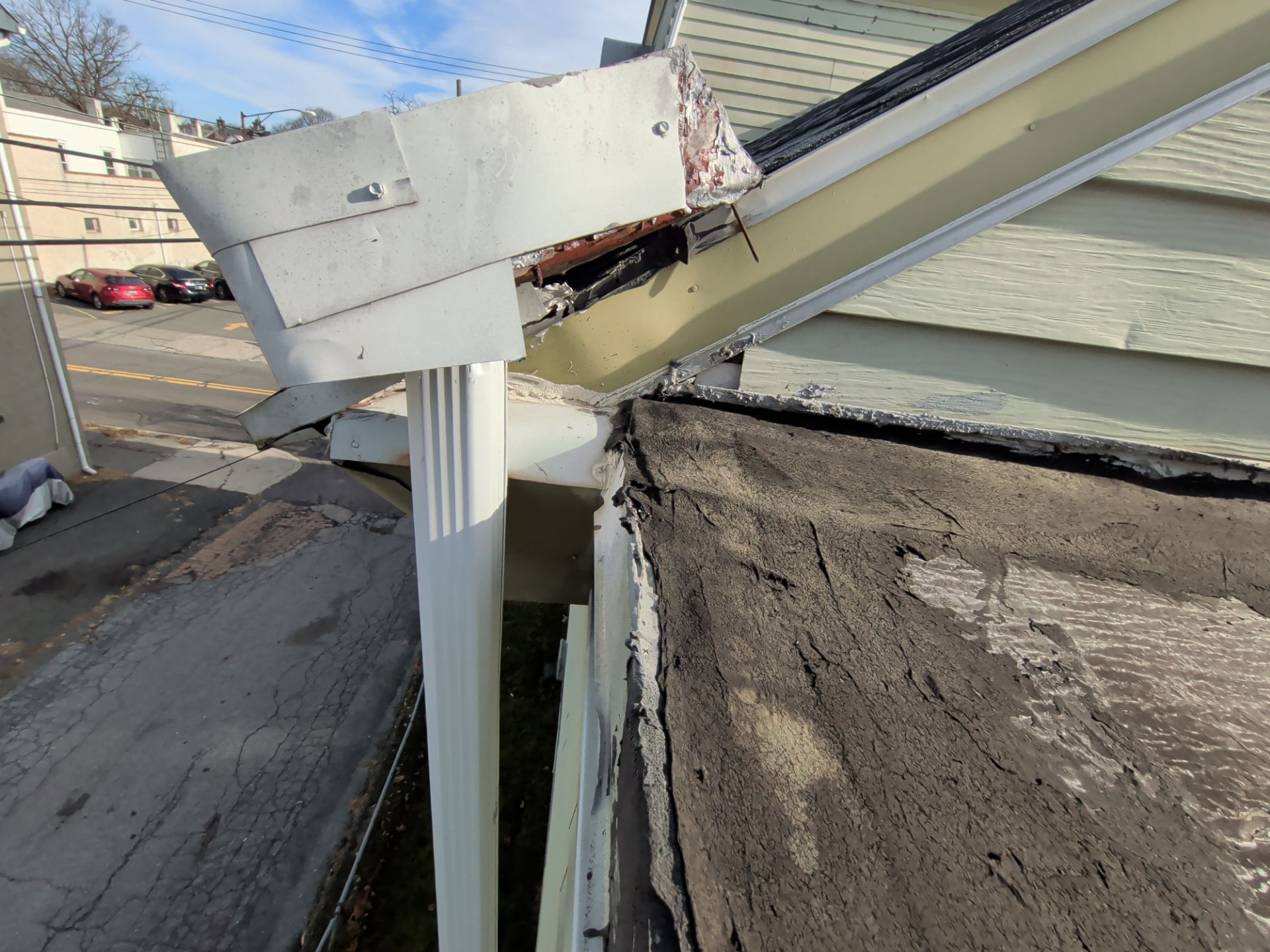 Damaged roof edge, flashing, and gutter connection on North Charlotte Street in Pottstown, PA
