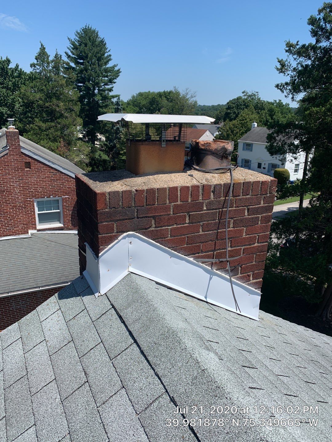 Residential roof flashing and chimney detail on Raymond Road