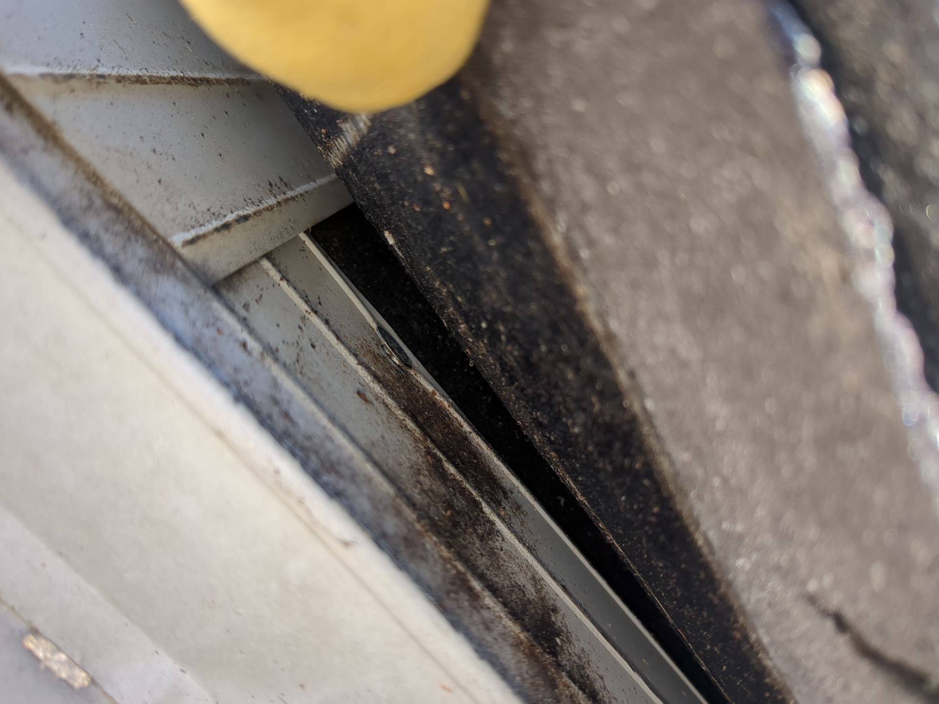 Close-up roof edge and metal flashing detail on Wayne Avenue in Narberth, PA
