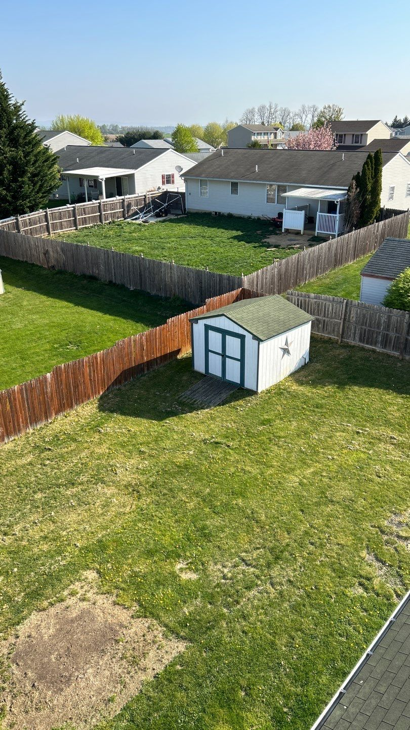 View of a residential property inspected from the roof on Treeline Drive.