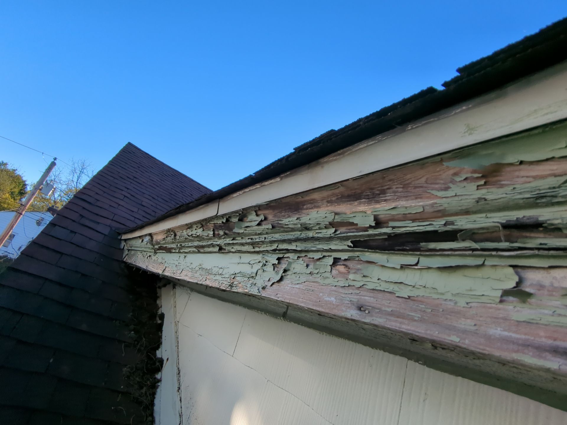 Damaged and deteriorated fascia along the roof edge on Dudley Avenue in Narberth, PA