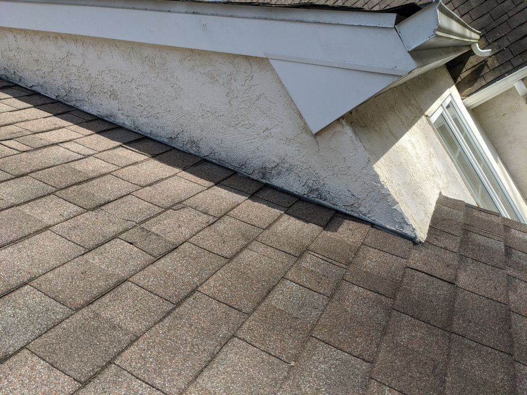 Roof flashing repair at roof-to-wall transition on Locksley Road in Glen Mills PA