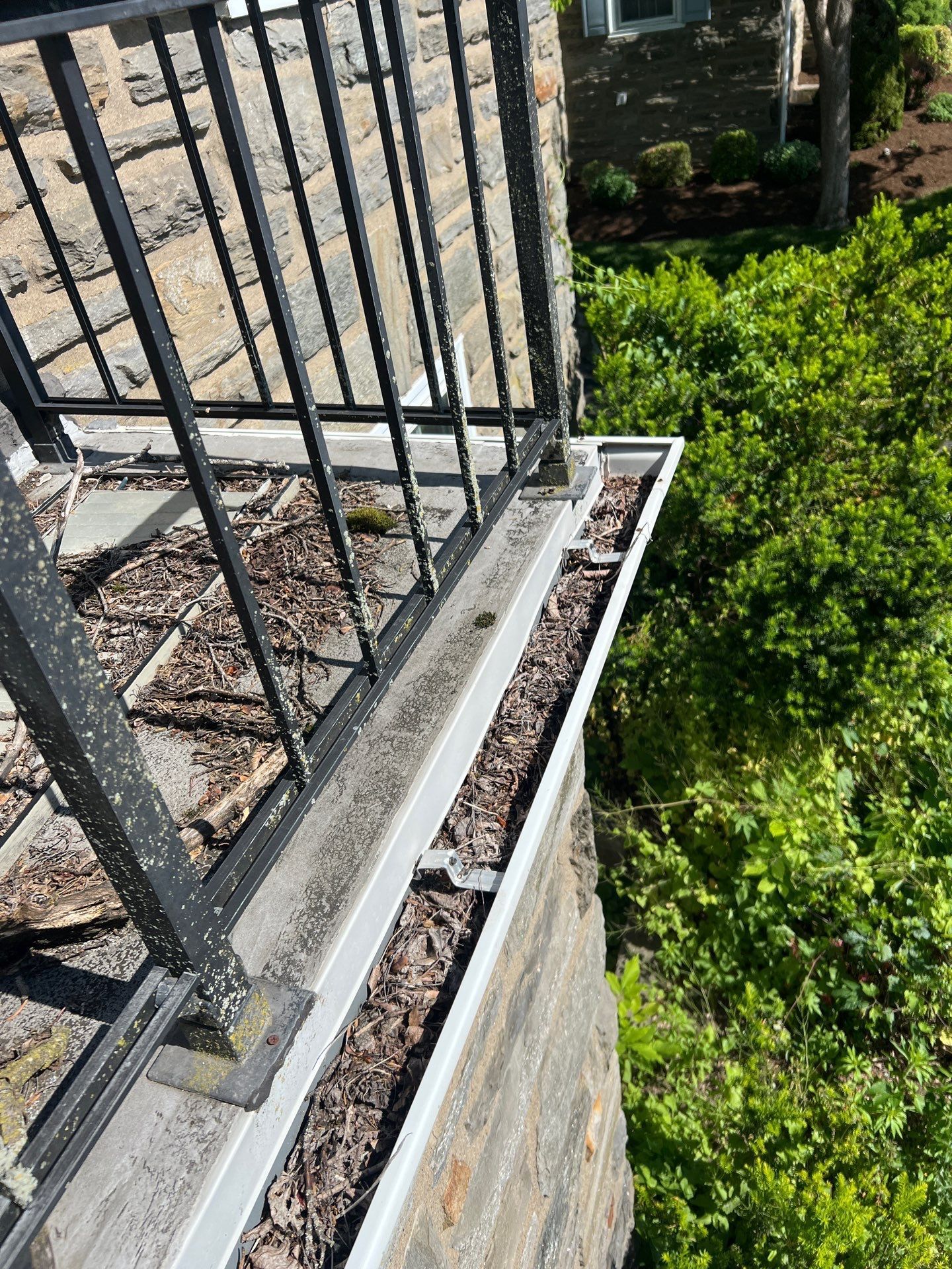 Roof repair and debris buildup along gutter on North New Ardmore Avenue in Ardmore, PA