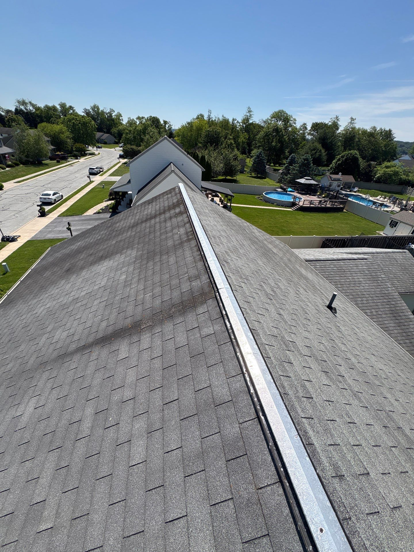 Roof repair process with ridge vent replacement on an asphalt shingle roof in Wrightsville, PA.