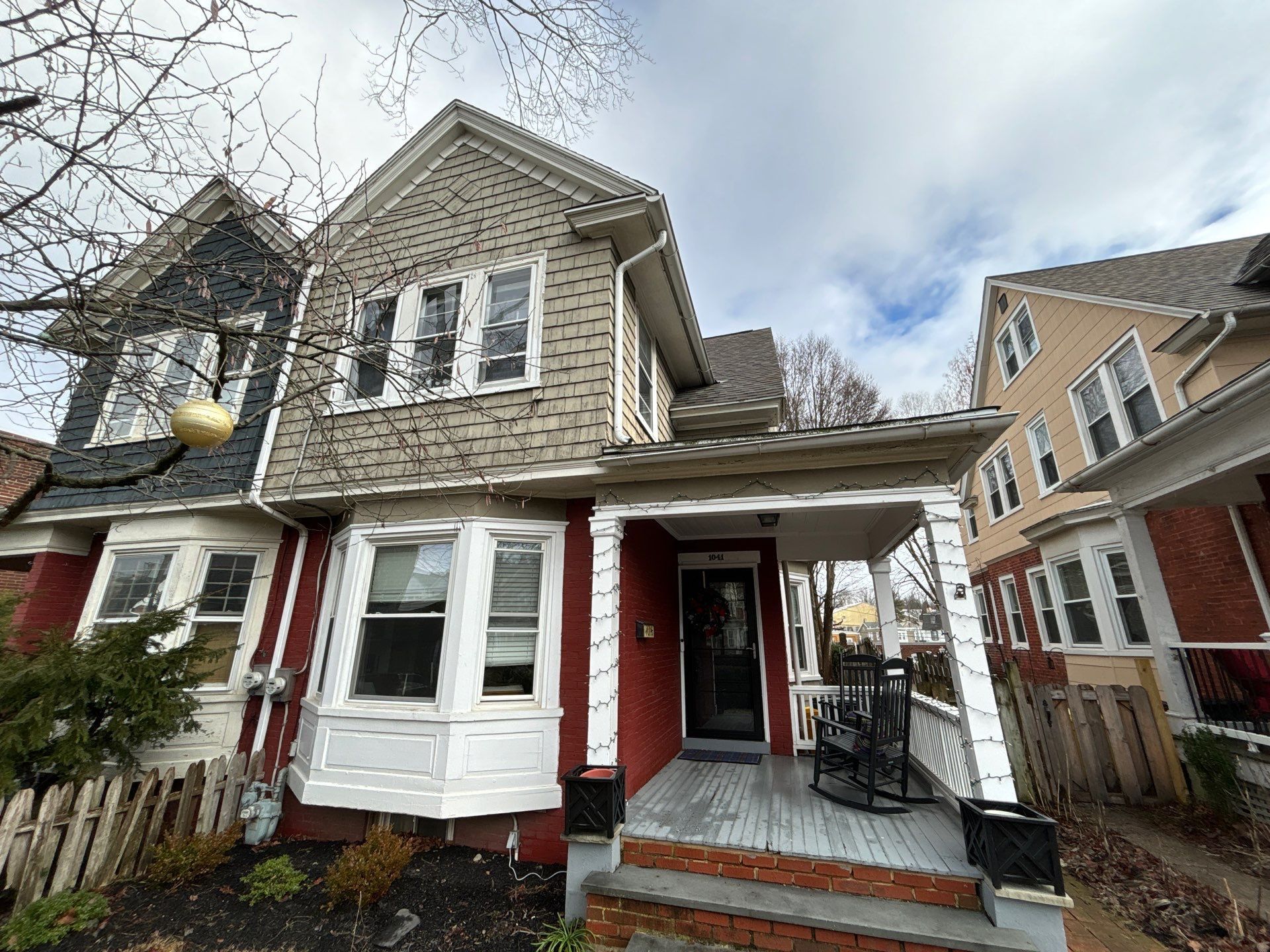 Residential roof repair project on Rees Avenue with multi-level shingle roofing