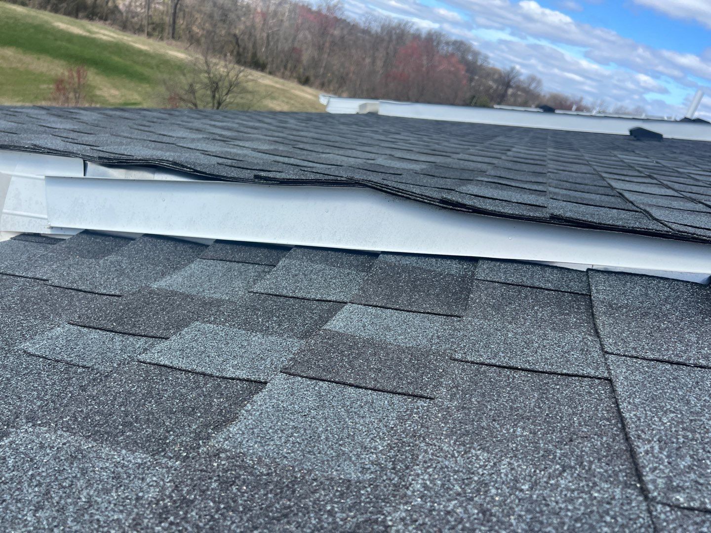 Roof-to-roof transition with flashing and asphalt shingles on Macdonald Avenue in Wyncote, PA