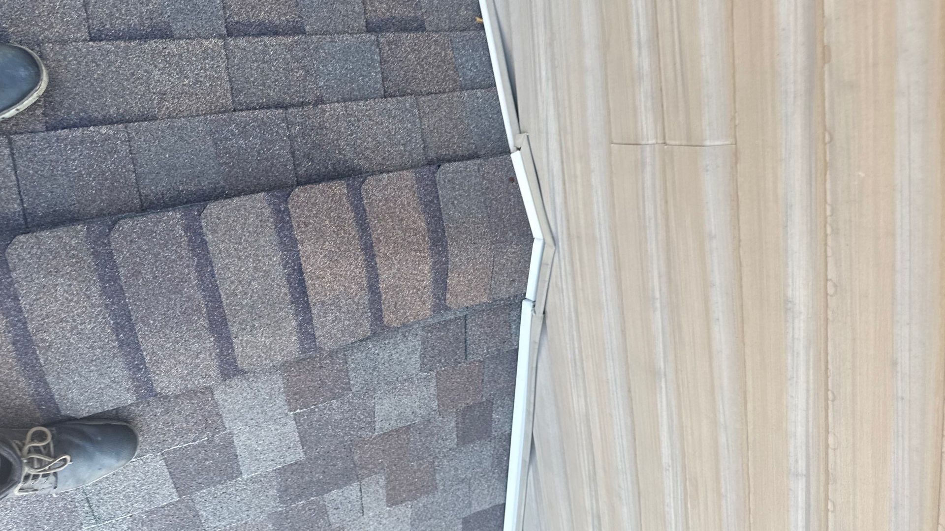 Asphalt shingle roof and flashing repair along siding on Spring Circle