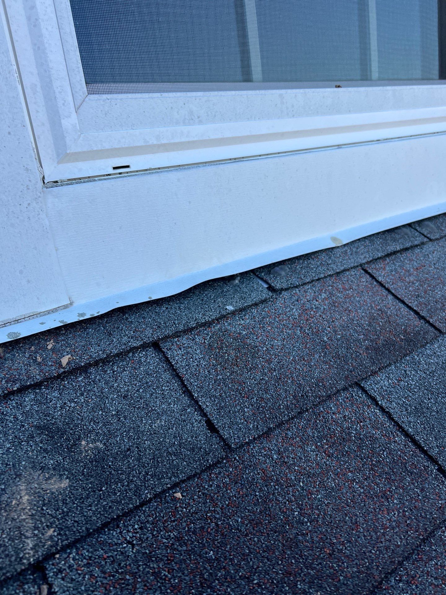 Roof shingles and window flashing detail on a home in Eagleville, PA