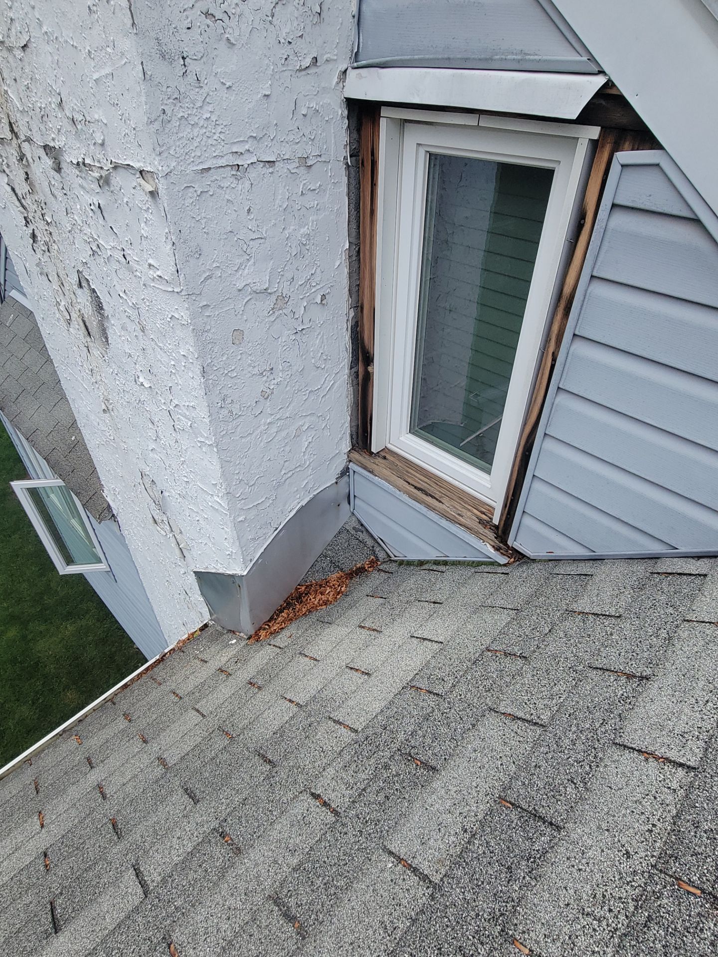 Roof repair and window flashing detail on Leslie Lane