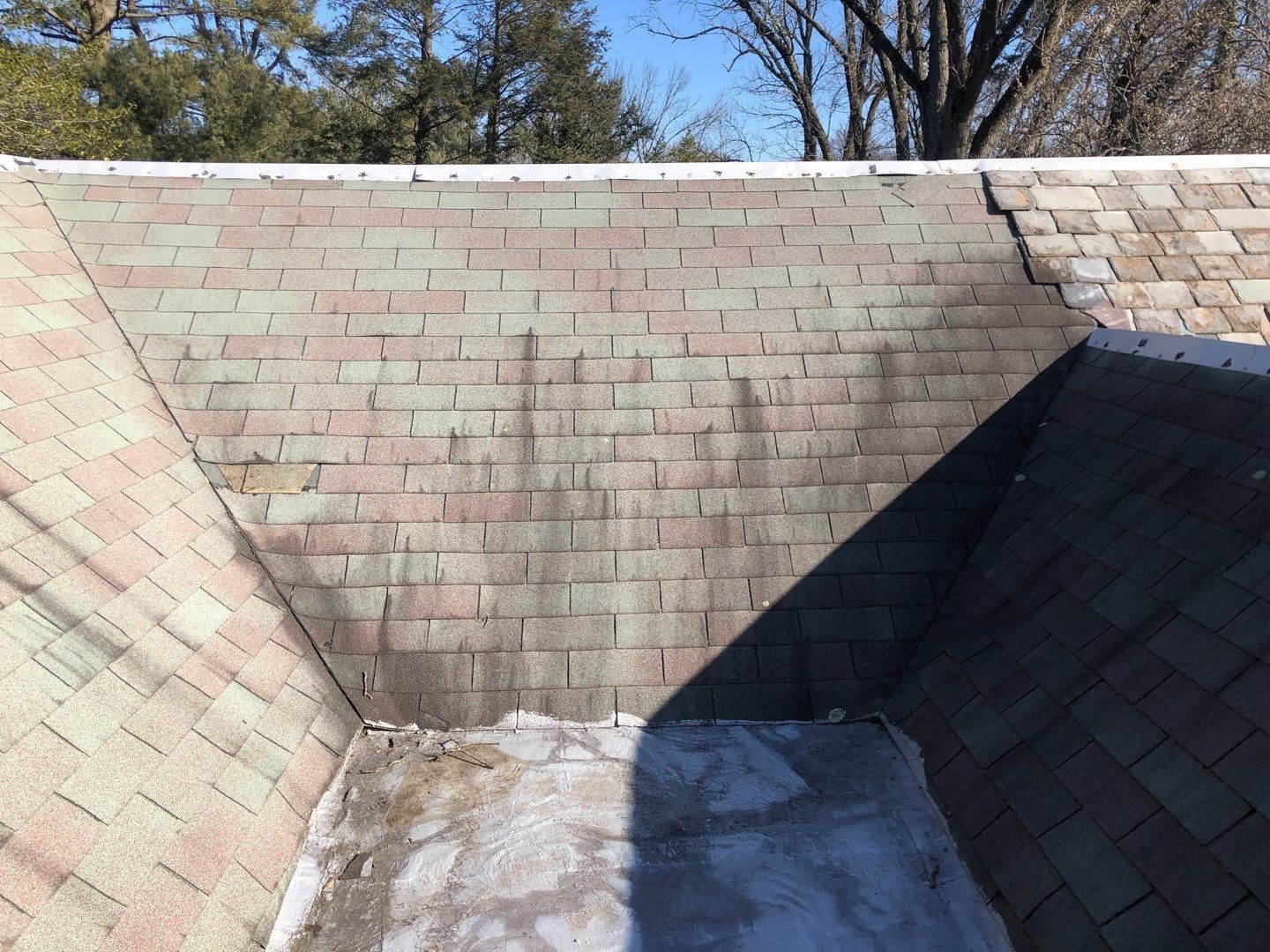 Worn asphalt shingle roof and valley area inspected by Joyland Roofing on Andover Road