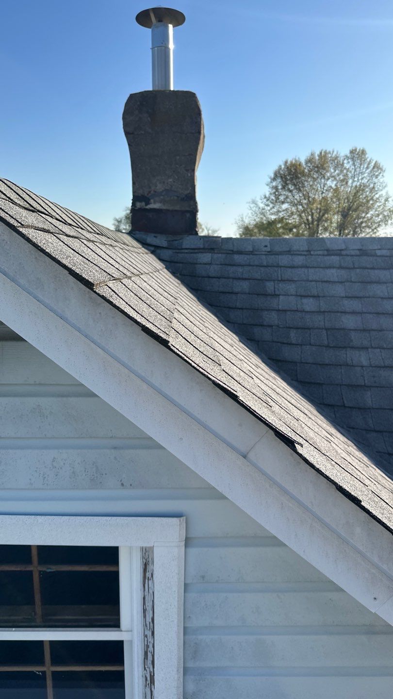 Roof replacement and chimney flashing work on a residential property along Fairview Avenue