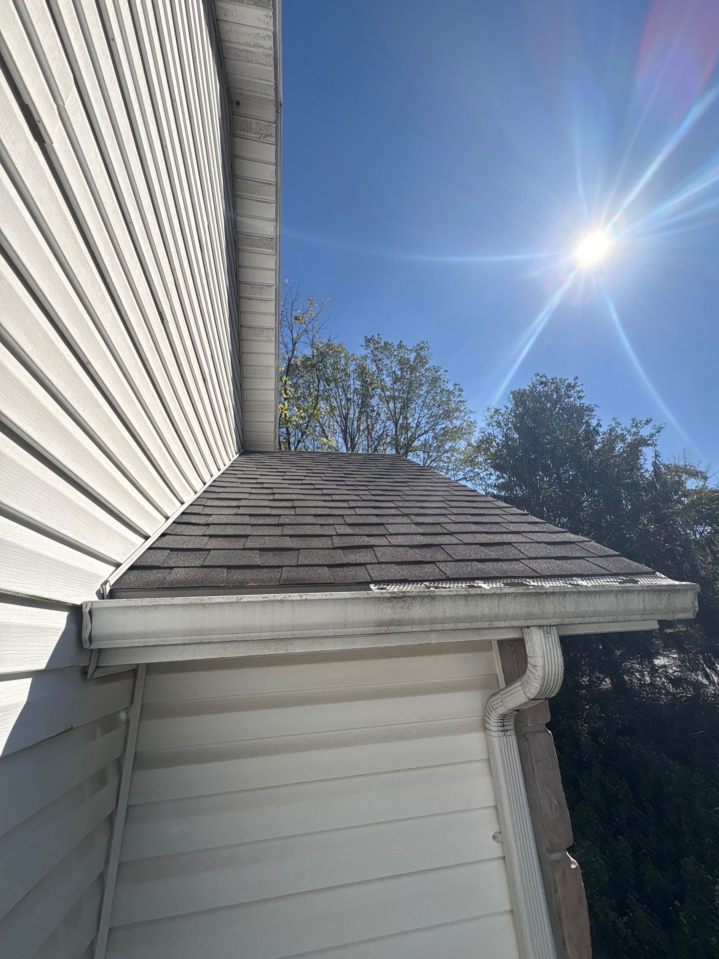 New architectural asphalt shingle roof installed on a home in Coover Court, Dillsburg, PA with clean gutters and updated roofing system.