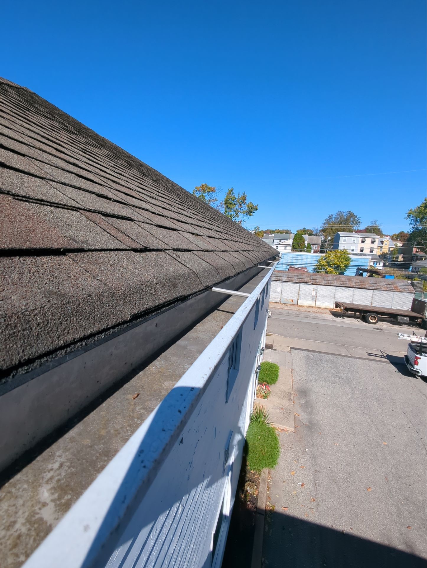 Asphalt shingle roof and gutter system on East Elm Street in Conshohocken, PA