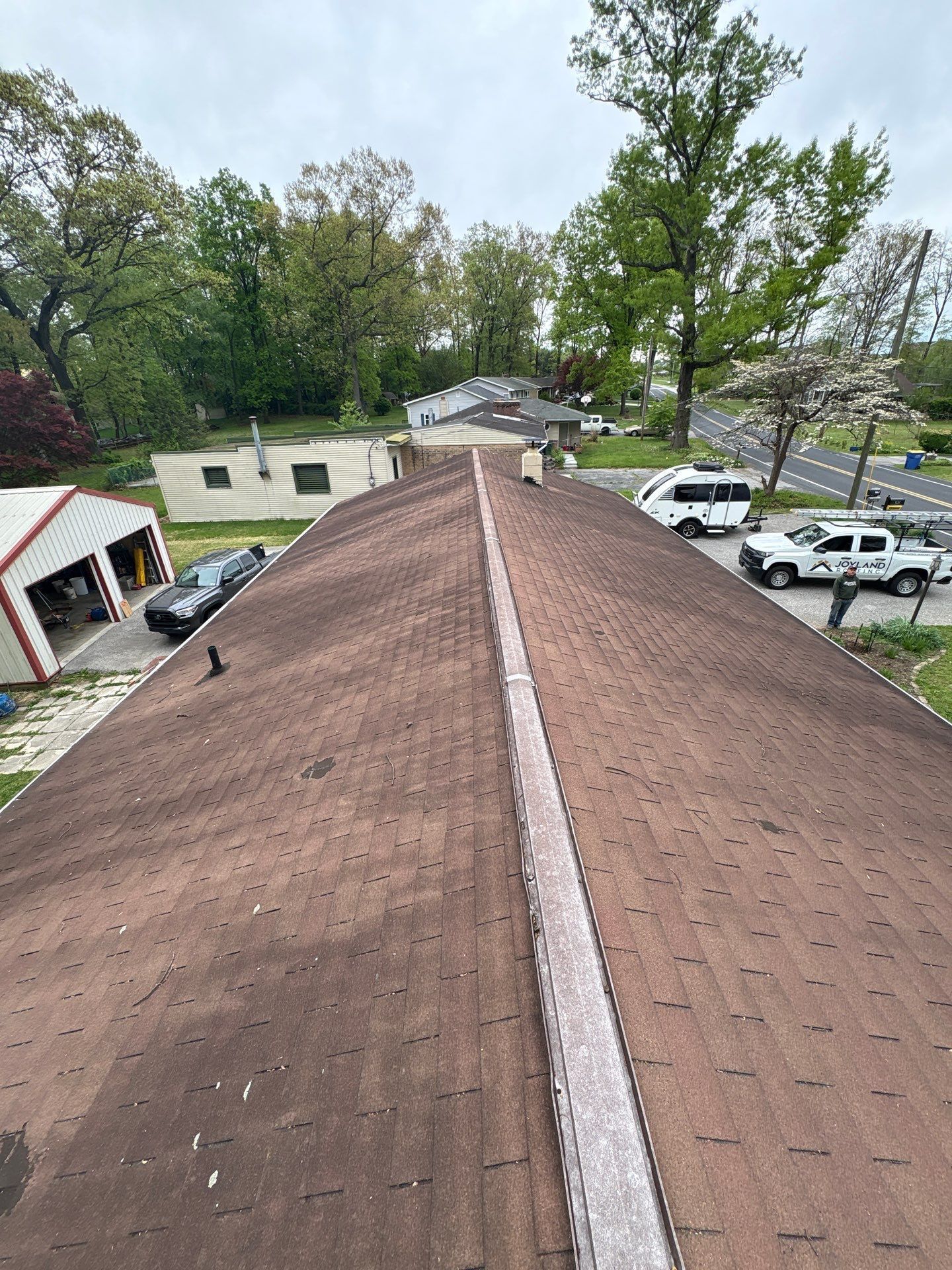 Existing asphalt shingle roof awaiting replacement on Oakwood Drive in Hanover, PA before installation of a new roofing system.