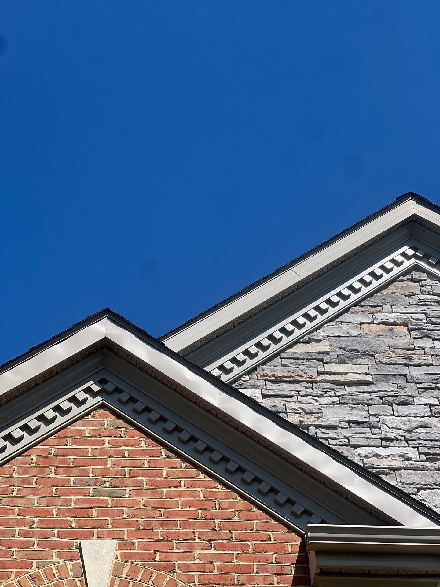 Roof replacement completed by Joyland Roofing in Lancaster, PA featuring updated gable trim and roofing details.