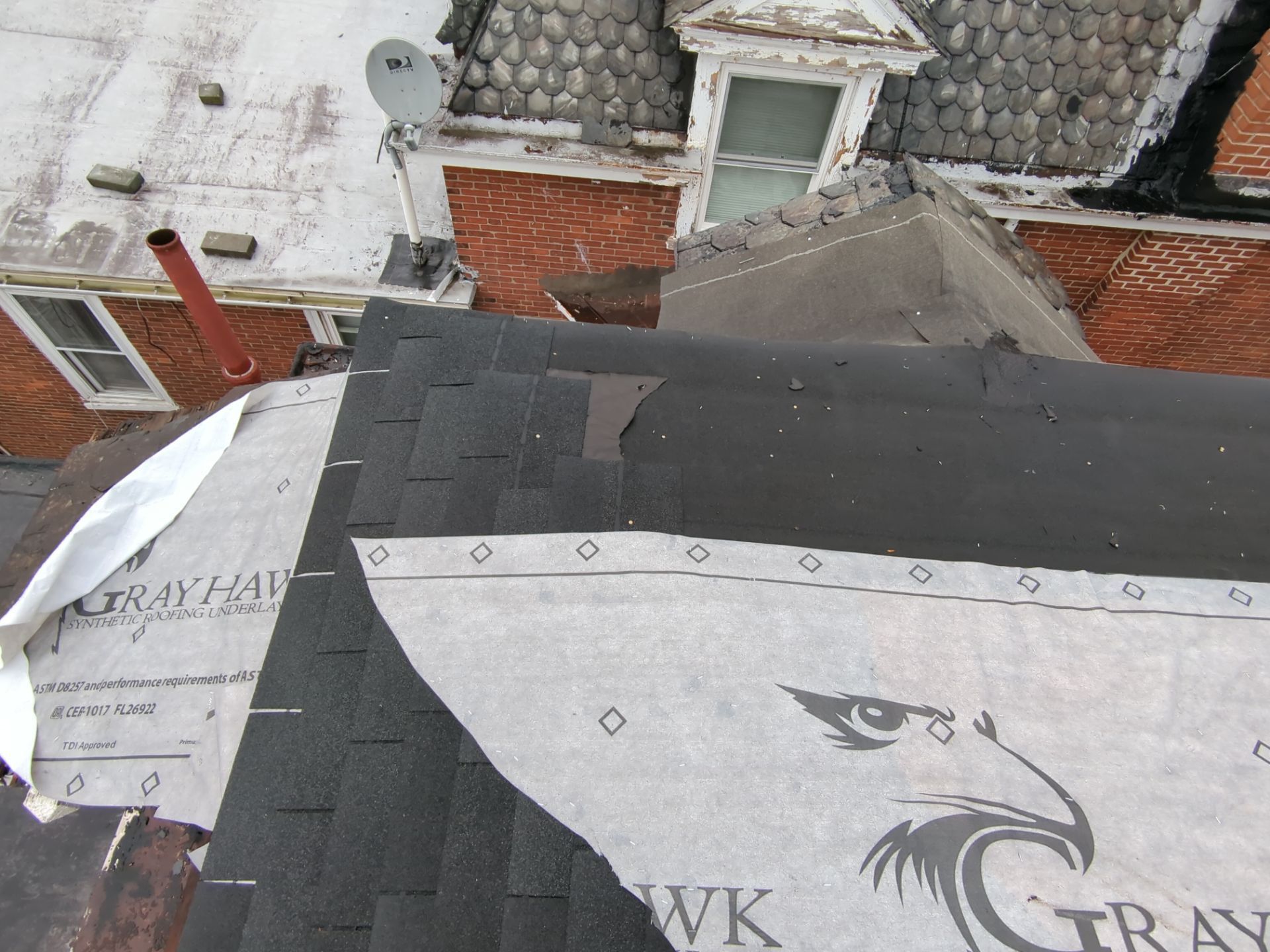 Roof replacement with new asphalt shingles and synthetic underlayment on George Street