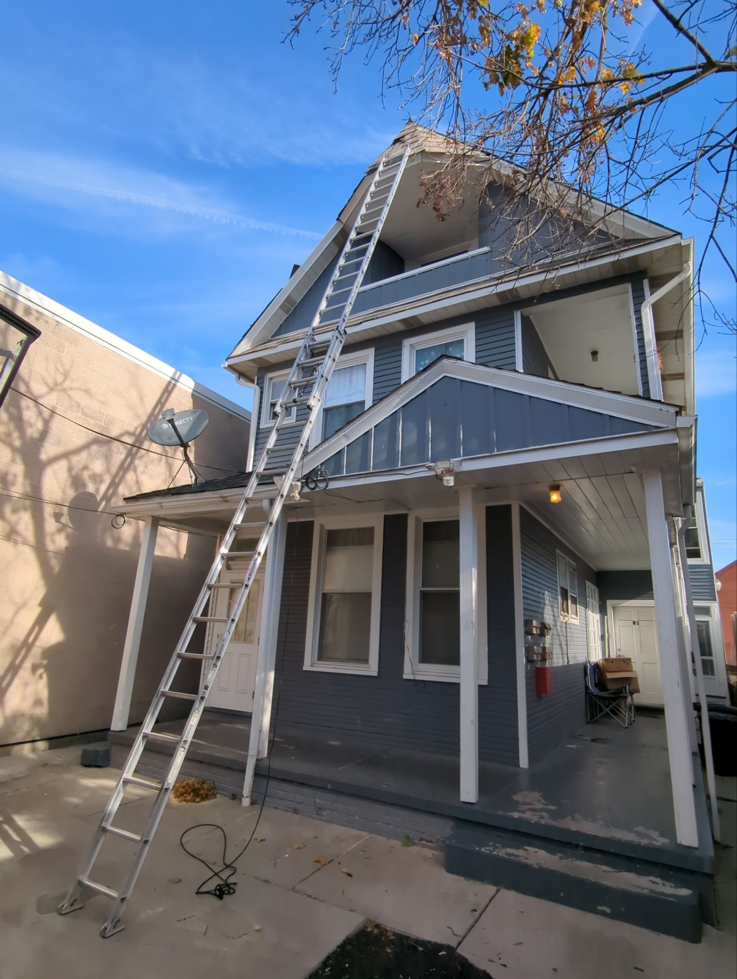 Roof replacement project in progress at a home on Carlisle Street in Hanover, PA with ladder access to the roof.