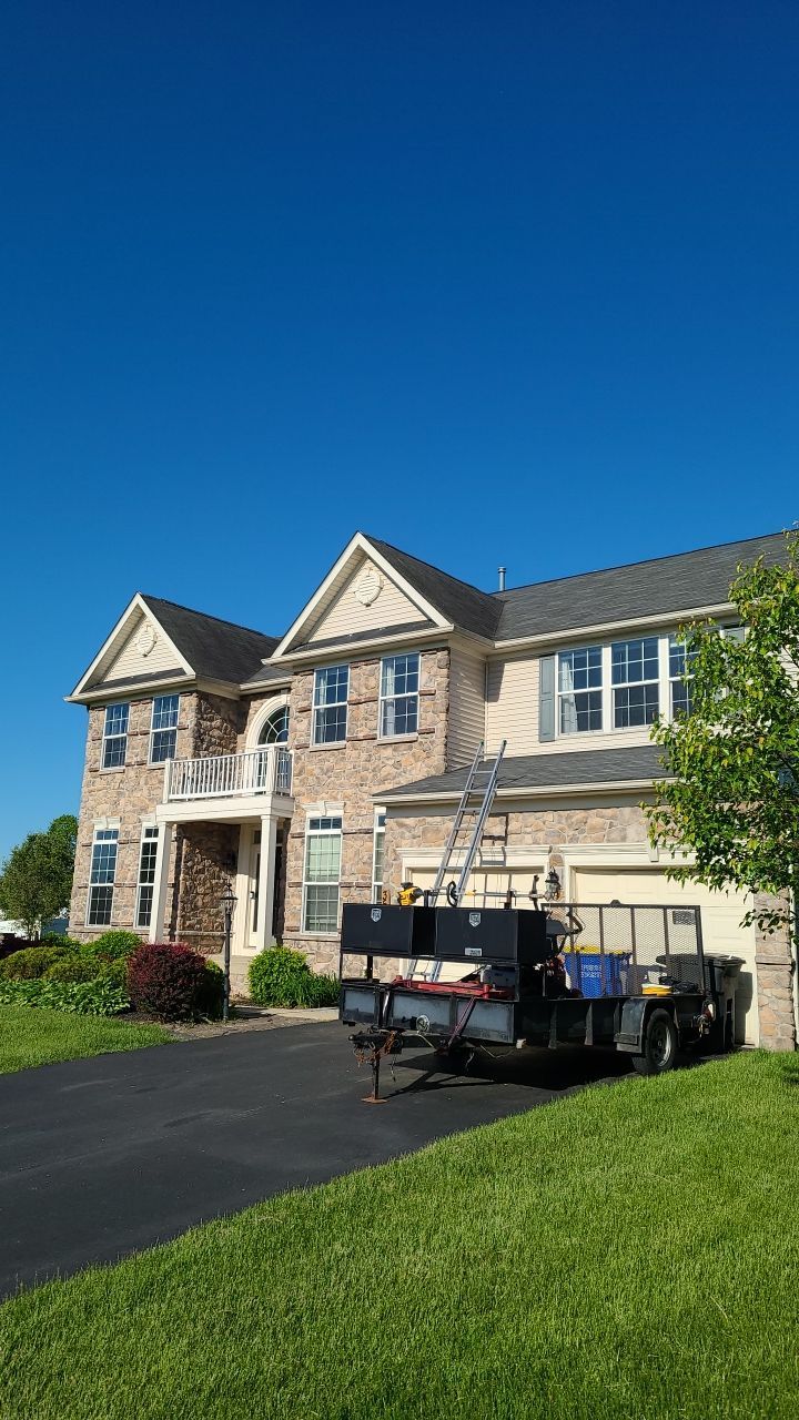 Residential home on Greenfield Street in Manchester, PA undergoing a professional roof replacement by Joyland Roofing.